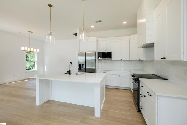 196 Folk Rd, Chesnee, SC 29323 - kitchen with stainless steel appliances, light wood-type flooring, tasteful backsplash, recessed lighting, and an island with sink