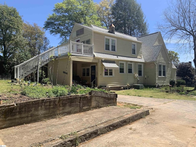 102 Highland Rd, Easley, SC 29640 - back of house with stairway, a wooden deck, a chimney, and roof with shingles