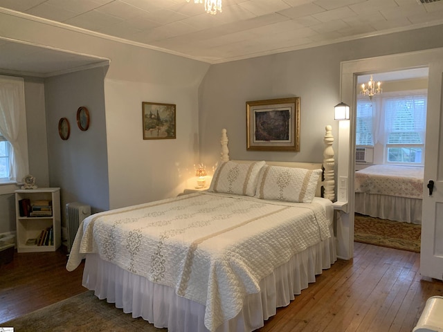 102 Highland Rd, Easley, SC 29640 - bedroom featuring a chandelier, ornamental molding, hardwood / wood-style flooring, and radiator heating unit