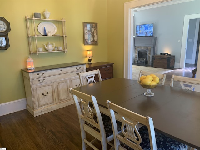 102 Highland Rd, Easley, SC 29640 - dining area featuring dark wood finished floors and a stone fireplace