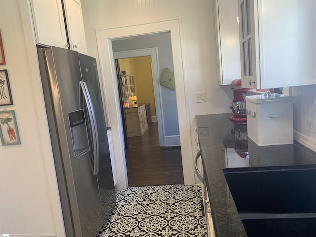 102 Highland Rd, Easley, SC 29640 - kitchen with stainless steel fridge, white cabinets, and dark wood-type flooring