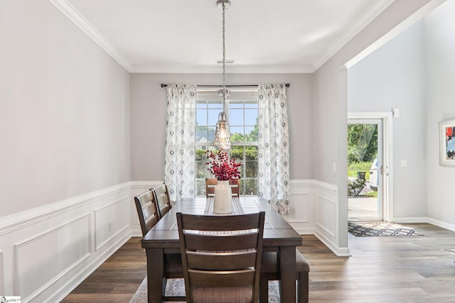 236 Worcester Ln, Easley, SC 29642 - dining area featuring dark wood finished floors, a wainscoted wall, ornamental molding, and a decorative wall