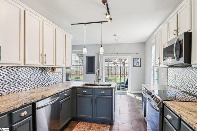 236 Worcester Ln, Easley, SC 29642 - kitchen featuring stainless steel appliances, a peninsula, white cabinets, and decorative backsplash