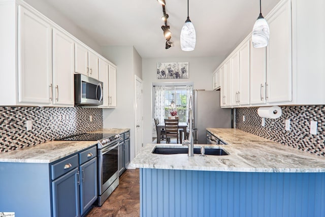 236 Worcester Ln, Easley, SC 29642 - kitchen with stainless steel appliances, blue cabinetry, white cabinetry, and a peninsula