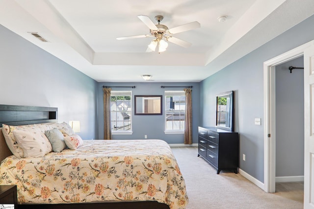 236 Worcester Ln, Easley, SC 29642 - bedroom with light colored carpet, a raised ceiling, and a ceiling fan