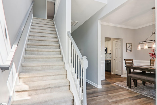 236 Worcester Ln, Easley, SC 29642 - staircase featuring wood finished floors and ornamental molding