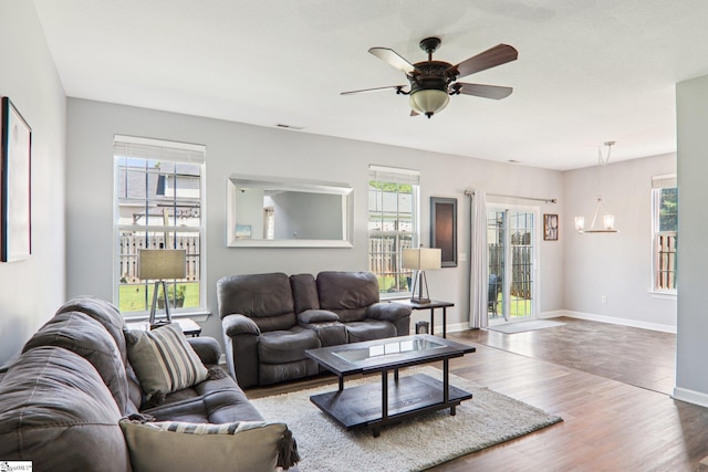 236 Worcester Ln, Easley, SC 29642 - living room featuring healthy amount of natural light, wood finished floors, and a chandelier