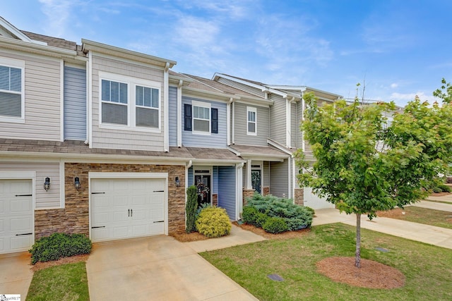 305 Yellow Fox Rd, Greer, SC 29650 - townhome / multi-family property featuring driveway, stone siding, and an attached garage