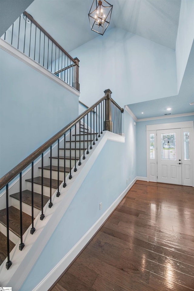 113 River Pines Trl, Greer, SC 29651 - foyer entrance with wood-type flooring, high vaulted ceiling, a chandelier, stairs, and recessed lighting