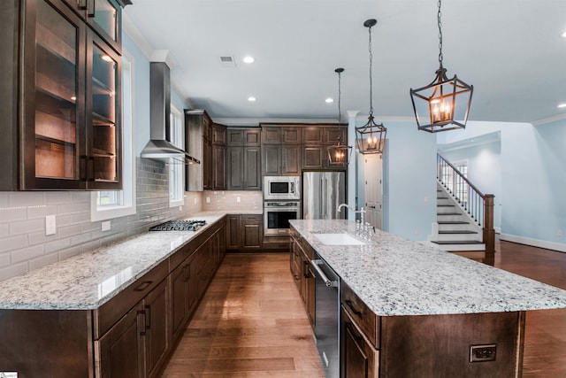 113 River Pines Trl, Greer, SC 29651 - kitchen with wall chimney exhaust hood, stainless steel appliances, dark brown cabinets, dark wood-type flooring, and recessed lighting