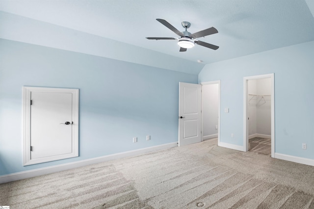 113 River Pines Trl, Greer, SC 29651 - unfurnished bedroom with carpet, vaulted ceiling, a walk in closet, a closet, and ceiling fan