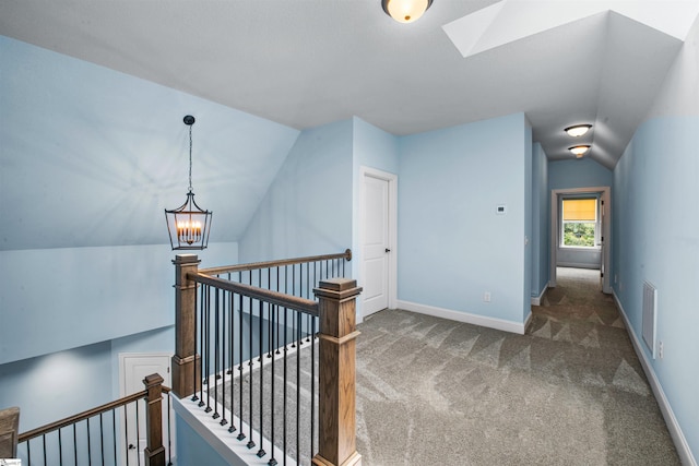 113 River Pines Trl, Greer, SC 29651 - hall featuring an upstairs landing, lofted ceiling, carpet flooring, a chandelier, and a skylight