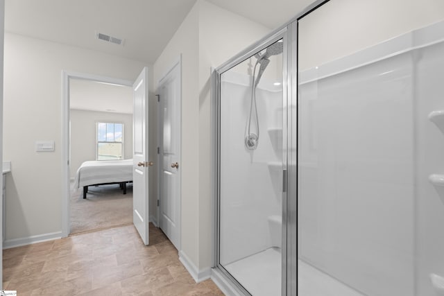 220 Emerald Creek Ave, Greer, SC 29651 - ensuite bathroom with a stall shower and stone finish floors