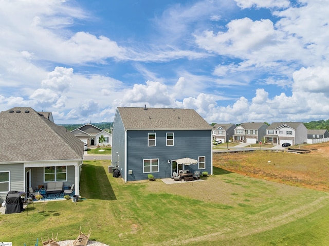 220 Emerald Creek Ave, Greer, SC 29651 - rear view of house featuring a residential view, a yard, and a patio