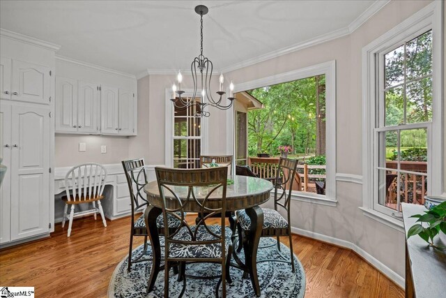 104 Shadowcreek Ct, Simpsonville, SC 29681 - dining space featuring a chandelier, light wood-style flooring, and ornamental molding