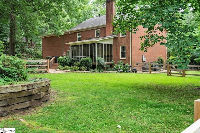 104 Shadowcreek Ct, Simpsonville, SC 29681 - back of property featuring a sunroom, a fenced backyard, brick siding, and a chimney