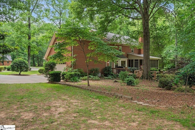 104 Shadowcreek Ct, Simpsonville, SC 29681 - view of home's exterior featuring driveway, a sunroom, and a garage