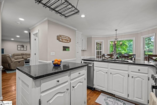 104 Shadowcreek Ct, Simpsonville, SC 29681 - kitchen featuring a kitchen island, white cabinets, crown molding, stainless steel dishwasher, and dark wood finished floors
