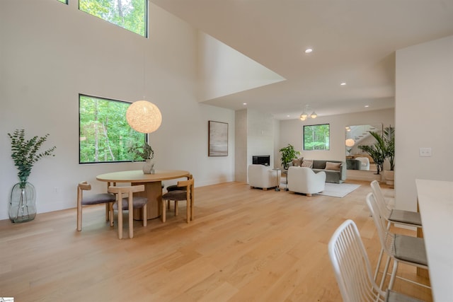 454 Enoree Rd, Travelers Rest, SC 29690 - dining area featuring light wood finished floors, recessed lighting, and a towering ceiling