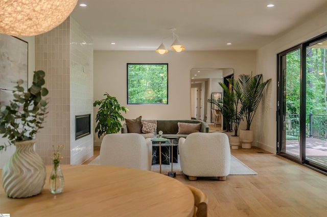 454 Enoree Rd, Travelers Rest, SC 29690 - dining room with light wood-type flooring, a fireplace, and recessed lighting