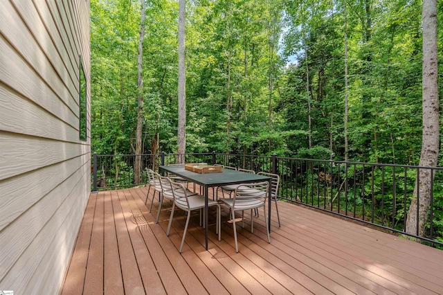 454 Enoree Rd, Travelers Rest, SC 29690 - wooden terrace featuring outdoor dining space and a view of trees