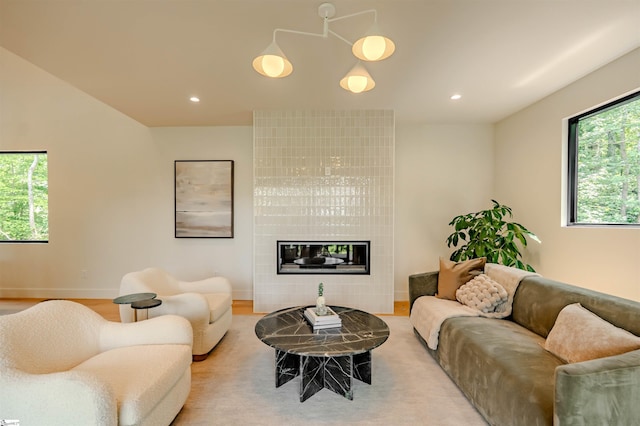 454 Enoree Rd, Travelers Rest, SC 29690 - living area with recessed lighting, light wood-type flooring, and a tile fireplace