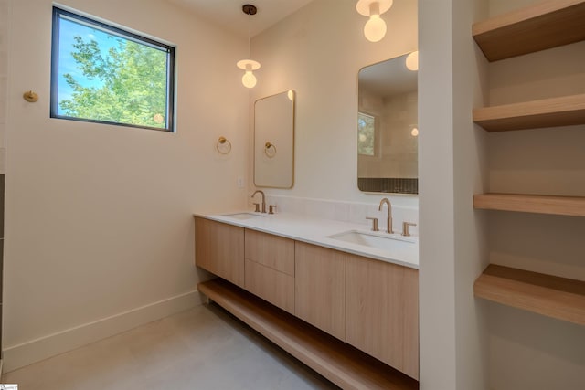 454 Enoree Rd, Travelers Rest, SC 29690 - bathroom featuring double vanity and baseboards