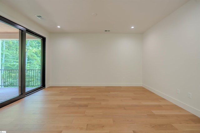 454 Enoree Rd, Travelers Rest, SC 29690 - empty room with healthy amount of natural light, light wood-style flooring, and recessed lighting