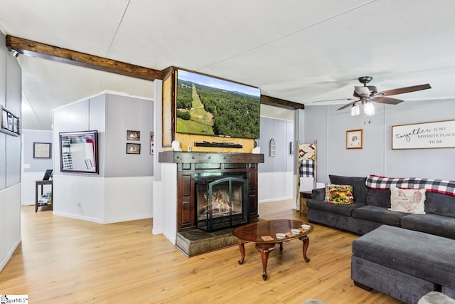 419-425 Chesapeake Trl, Pickens, SC 29671 - living area with light wood-style flooring, a warm lit fireplace, beamed ceiling, and ceiling fan