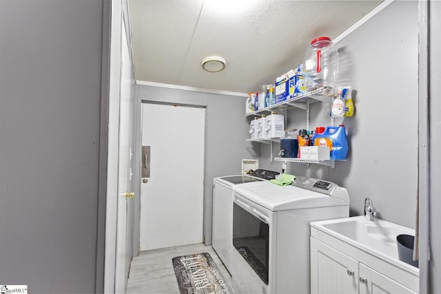 419-425 Chesapeake Trl, Pickens, SC 29671 - laundry area with washer and dryer, a textured ceiling, light wood-style flooring, and ornamental molding