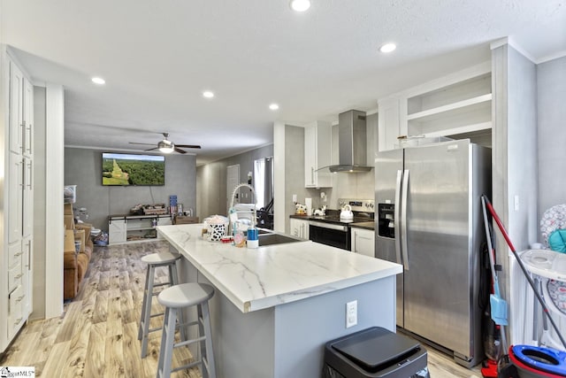 419-425 Chesapeake Trl, Pickens, SC 29671 - kitchen with appliances with stainless steel finishes, wall chimney range hood, light wood finished floors, open shelves, and white cabinets