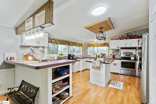 419-425 Chesapeake Trl, Pickens, SC 29671 - kitchen with stainless steel appliances, white cabinets, light wood finished floors, ornamental molding, and a wainscoted wall