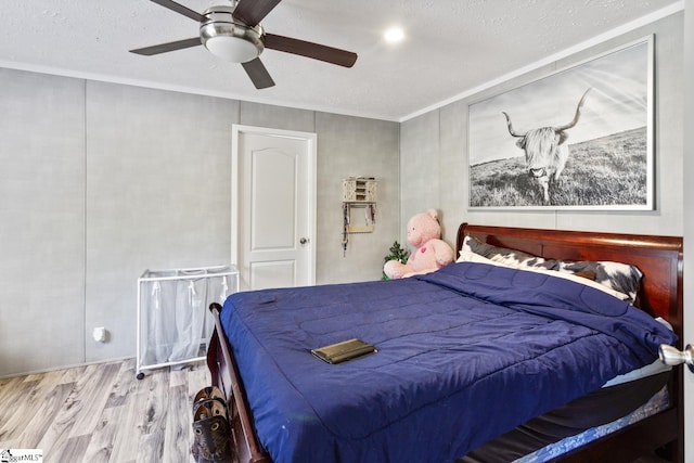 419-425 Chesapeake Trl, Pickens, SC 29671 - bedroom featuring wood finished floors, ceiling fan, ornamental molding, and a textured ceiling