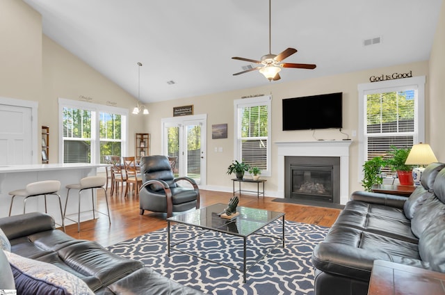 104 Mares Head Pl, Taylors, SC 29687 - living area featuring wood finished floors, ceiling fan, healthy amount of natural light, and high vaulted ceiling