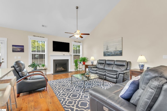 104 Mares Head Pl, Taylors, SC 29687 - living area with wood finished floors, a fireplace with flush hearth, a ceiling fan, and vaulted ceiling