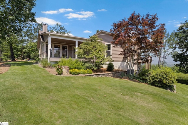 600 Packs Mountain Ridge Rd, Taylors, SC 29687 - view of property exterior with a chimney and a yard