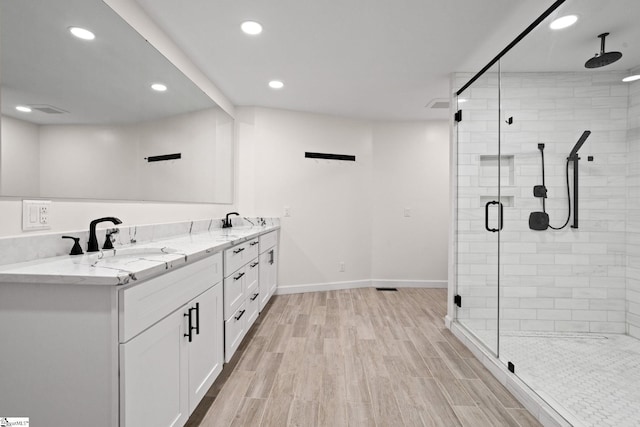 600 Packs Mountain Ridge Rd, Taylors, SC 29687 - full bathroom featuring a shower stall, wood finished floors, double vanity, and recessed lighting