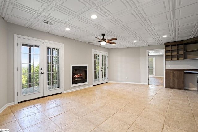 600 Packs Mountain Ridge Rd, Taylors, SC 29687 - unfurnished living room with french doors, ceiling fan, recessed lighting, light tile patterned floors, and an ornate ceiling
