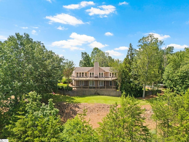 600 Packs Mountain Ridge Rd, Taylors, SC 29687 - back of property featuring a chimney, a lawn, and a deck