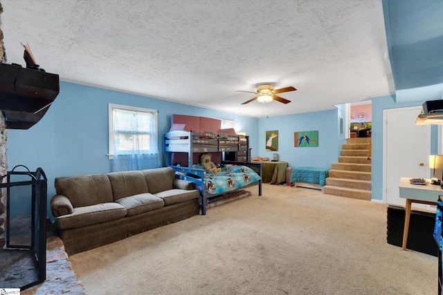 5 Nova St, Taylors, SC 29687 - living area featuring stairs, carpet flooring, ceiling fan, and a textured ceiling