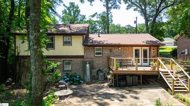 5 Nova St, Taylors, SC 29687 - rear view of house with a deck, brick siding, stairs, and a patio