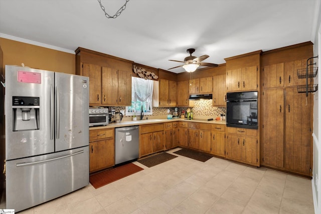 5 Nova St, Taylors, SC 29687 - kitchen featuring stainless steel appliances, brown cabinets, light countertops, and ornamental molding