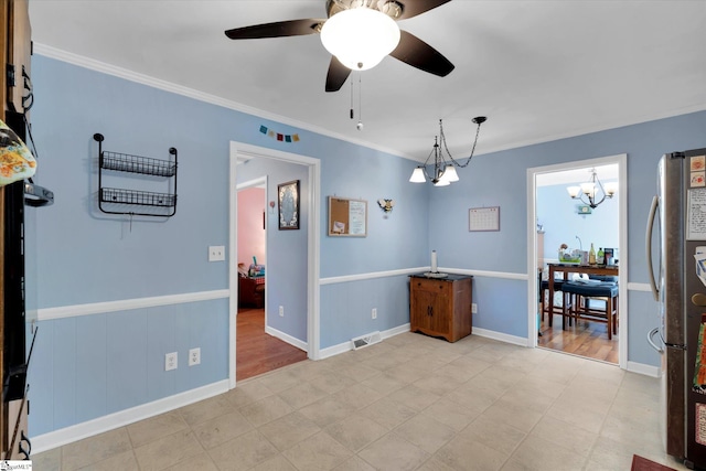5 Nova St, Taylors, SC 29687 - spare room with ornamental molding, ceiling fan, and a chandelier
