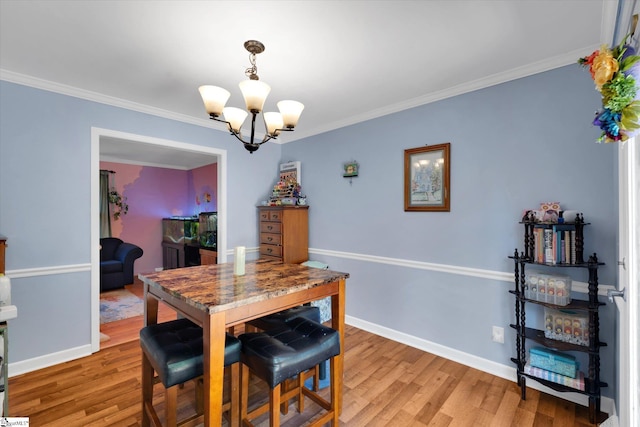 5 Nova St, Taylors, SC 29687 - dining space with a chandelier, light wood-style floors, and ornamental molding