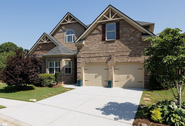 215 Wando Way, Greer, SC 29650 - craftsman-style home with concrete driveway, brick siding, a garage, and a front yard