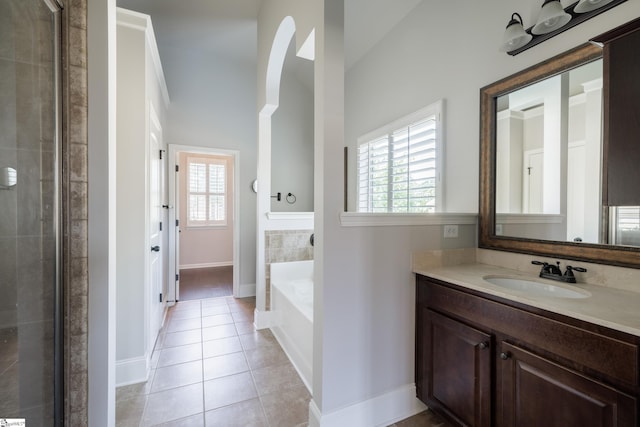 215 Wando Way, Greer, SC 29650 - bathroom with tile patterned flooring, vanity, a garden tub, and healthy amount of natural light
