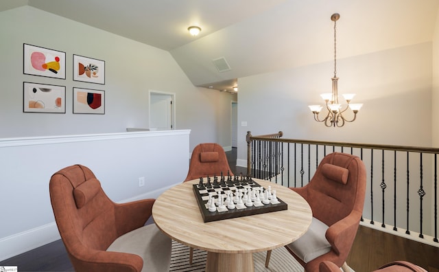 215 Wando Way, Greer, SC 29650 - living area with vaulted ceiling, a chandelier, wood finished floors, and an upstairs landing