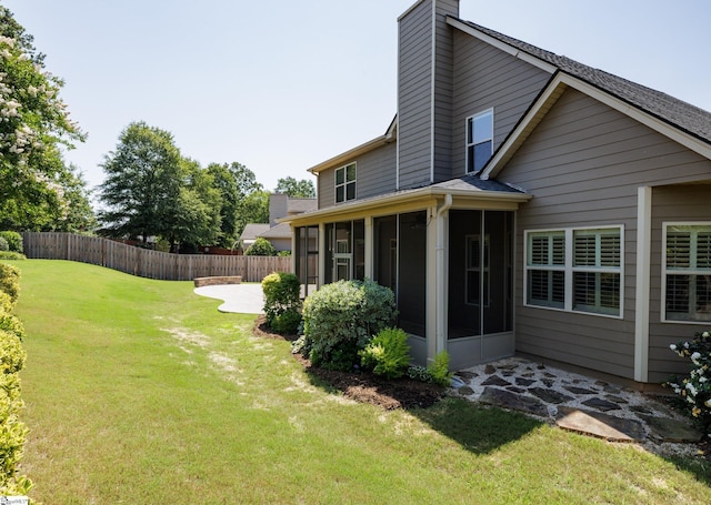 215 Wando Way, Greer, SC 29650 - back of property with a sunroom, a chimney, and a patio area