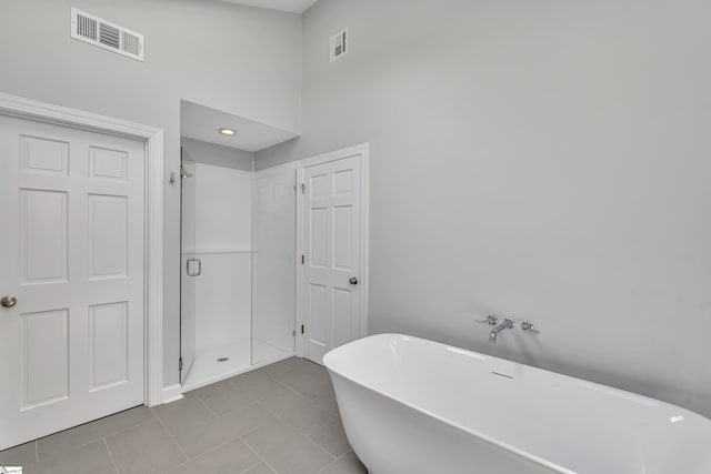 111 Brandon Way, Simpsonville, SC 29681 - full bath with a soaking tub, a shower stall, and tile patterned flooring