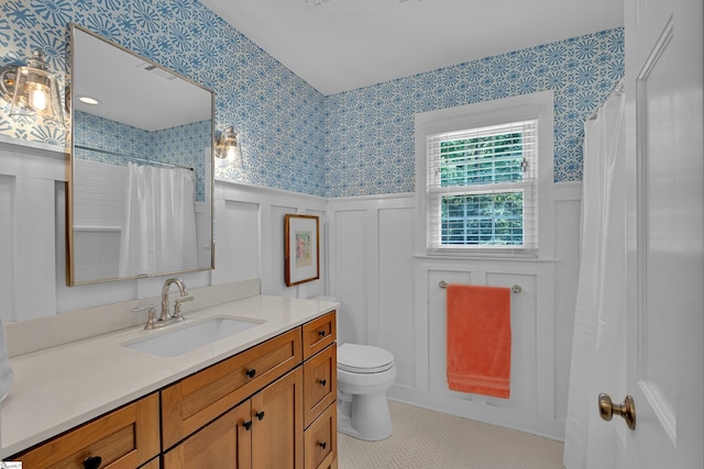 111 Brandon Way, Simpsonville, SC 29681 - full bath featuring wallpapered walls, a decorative wall, vanity, wainscoting, and tile patterned floors